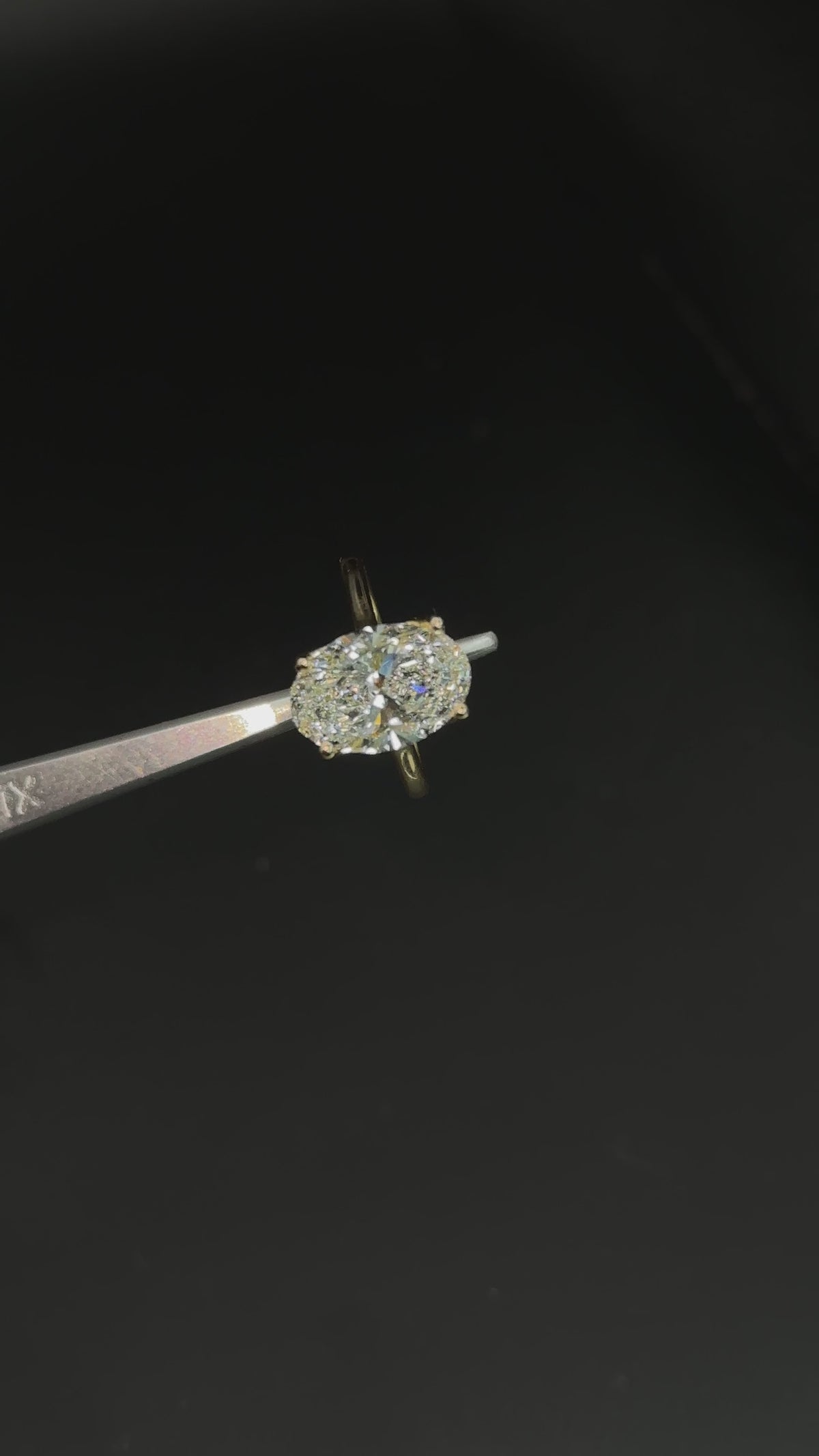 Oval engagement ring with hidden halo