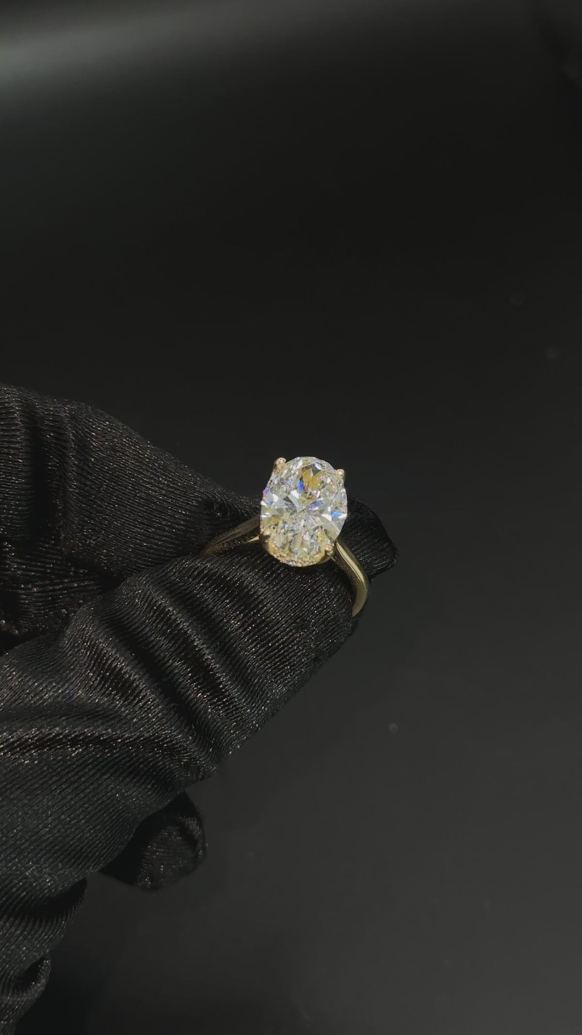 Oval engagement ring with hidden halo